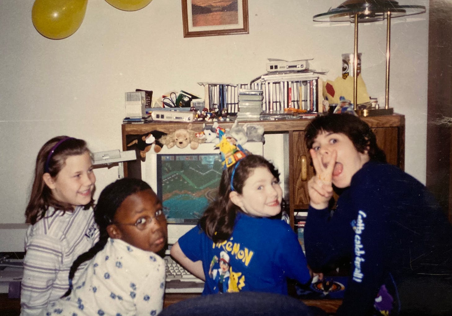 Carrie, her brother, and her friends playing Roller Coaster Tycoon together