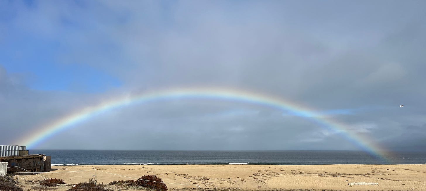 full rainbow over ocean healing grief