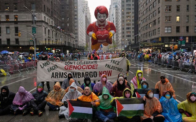 Anti-Israel, pro-Palestinian protesters demonstrate on Sixth Avenue during the Macy's Thanksgiving Day Parade, November 28, 2024, in New York. (AP Photo/Julia Demaree Nikhinson)