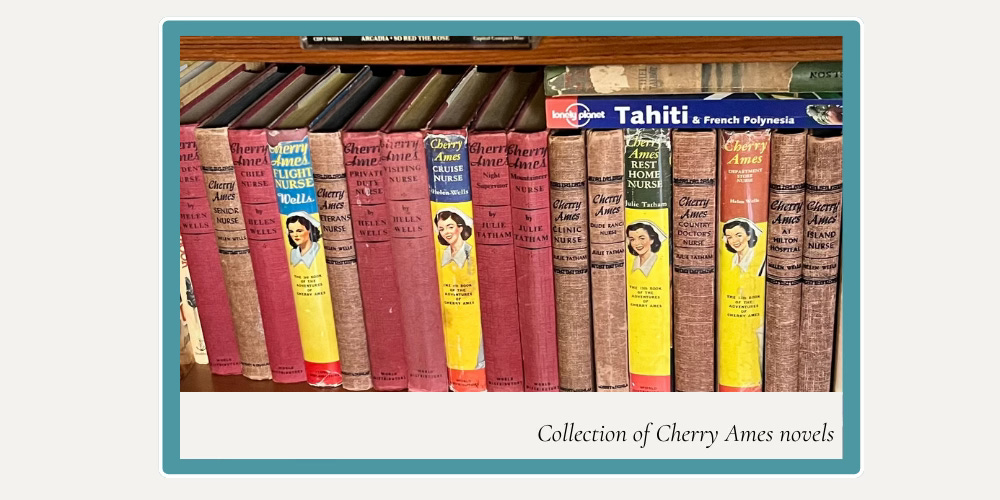 a shelf of Cherry Ames novels, most with faded red covers