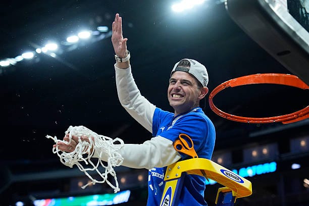 Head coach Todd Golden of the Florida Gators reacts after cutting down the net after defeating the Texas Tech Red Raiders 84-79 in the West Regional...