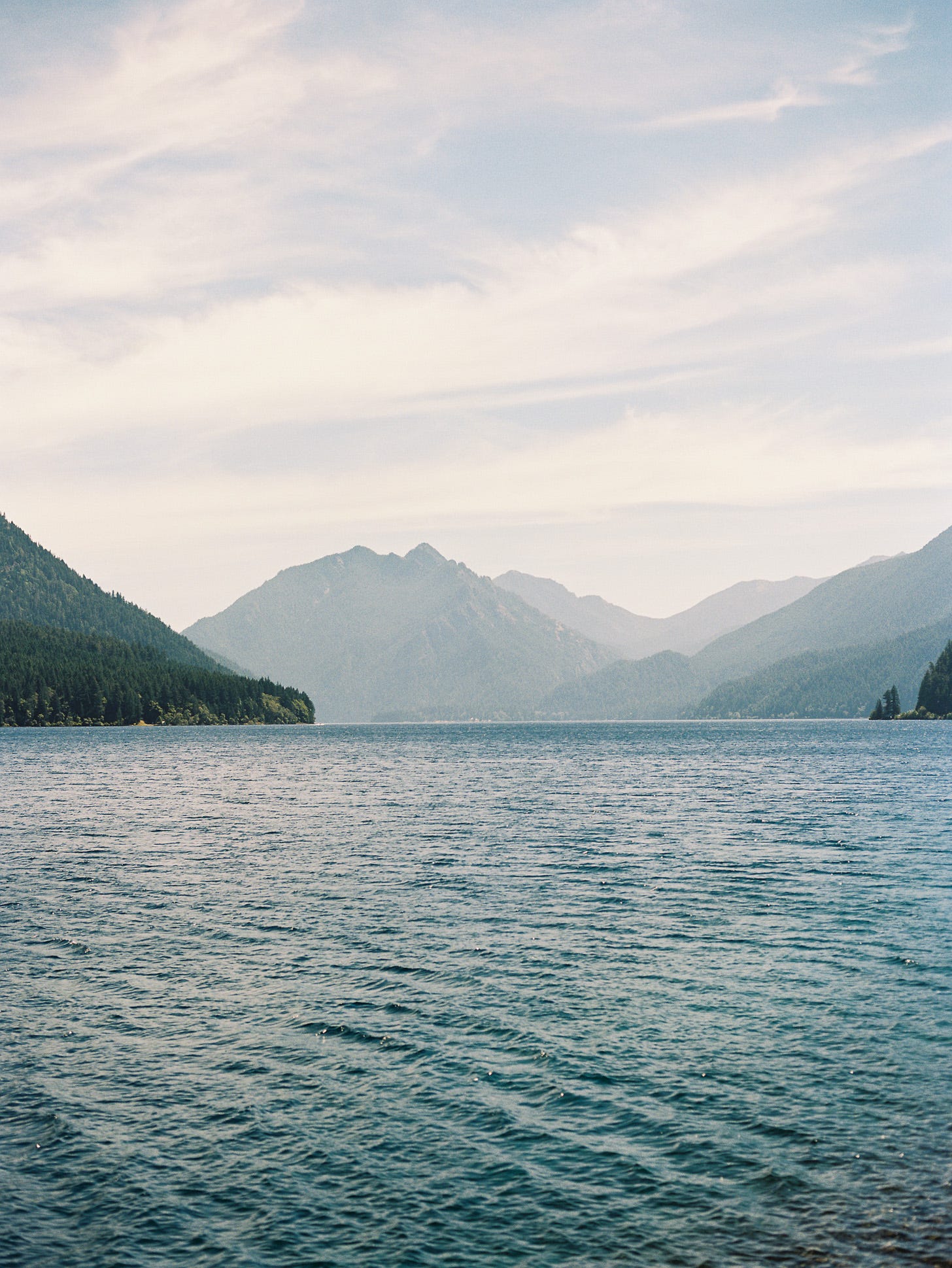 Photo of Lake Crescent backed by the Olympic mountains