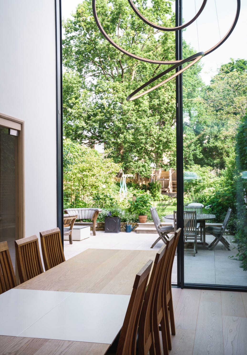 view from the inside of a house looking out onto the garden