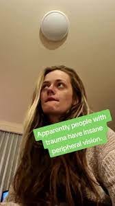 A screenshot of a tiktok of a girl looking nervous and biting her lip with the caption: apparently people with trauma have insane peripheral vision. Note that there's no citation for this claim.