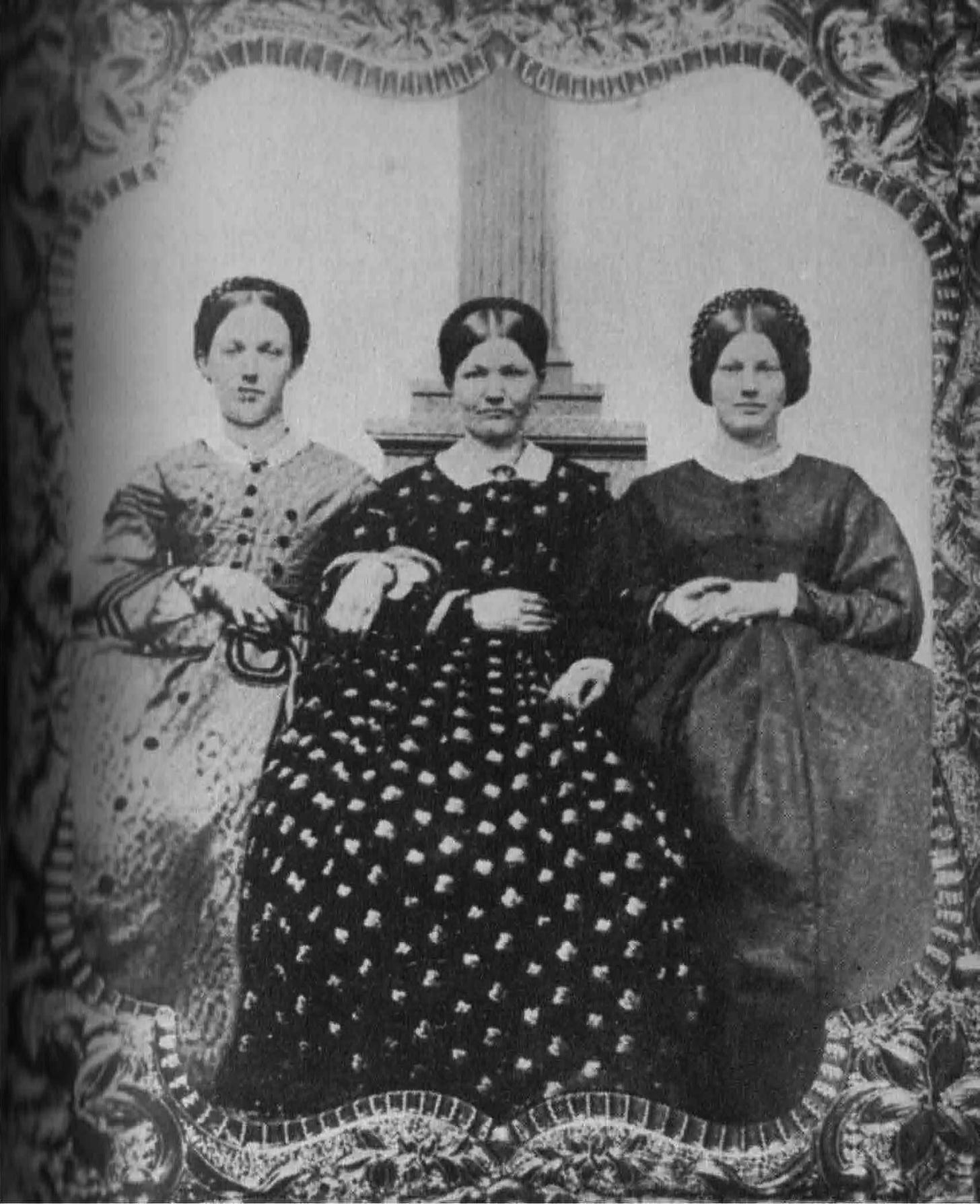 Black-and-white photo of Jennie Wade (far-right), her sister, and her mother.