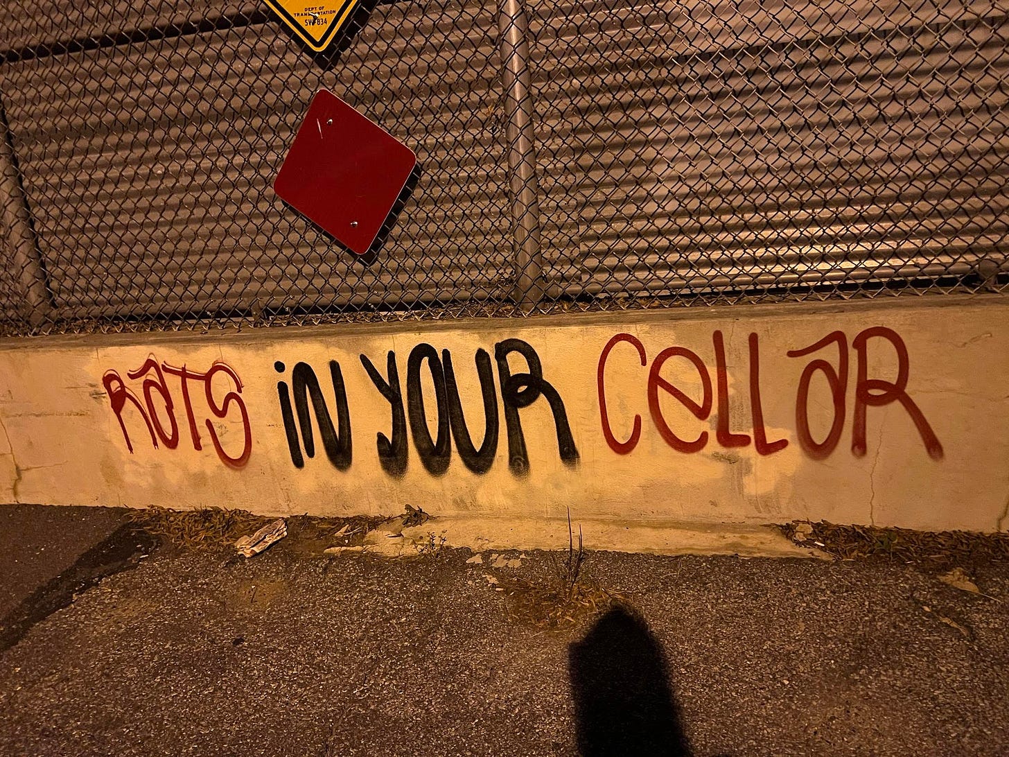 "Rats in your cellar" tagged on a low cement wall.