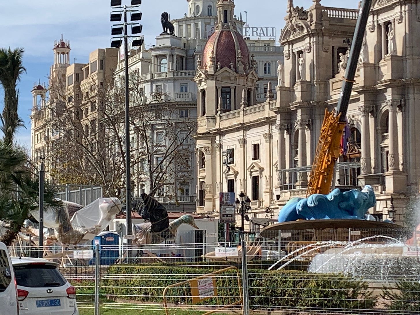 In the Plaça de l'Ajuntament, mysterious wrapped figures lay behind fencing