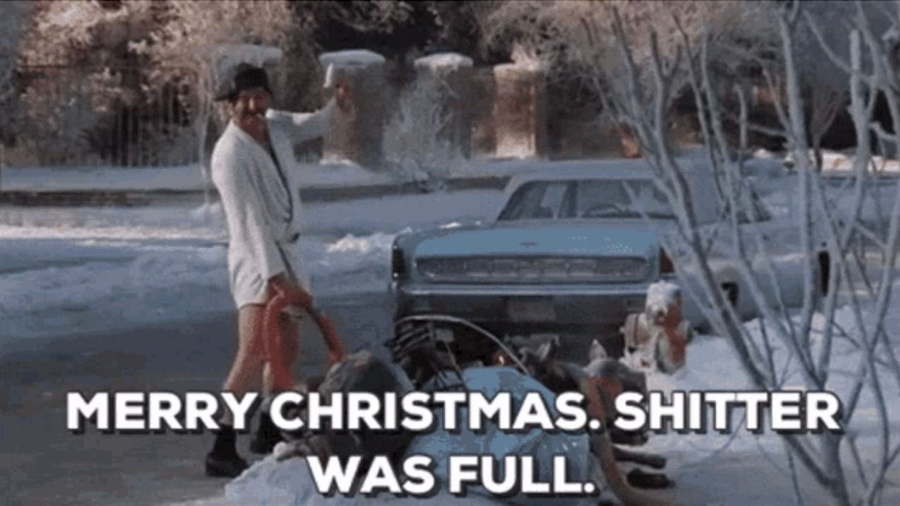 An asshat in a short bathrobe, boots, and a hunting cap lifts a beer and grins while emptying a chemical toilet into the sewer drain. He wishes us, "Merry Christmas! Shitter was full!"