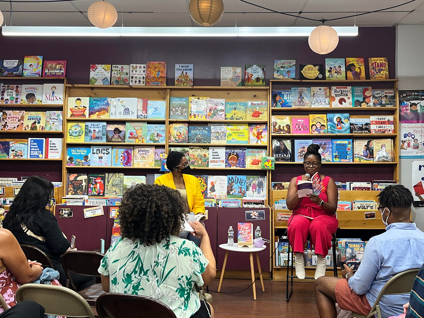 Picture of an author reading at a bookstore 