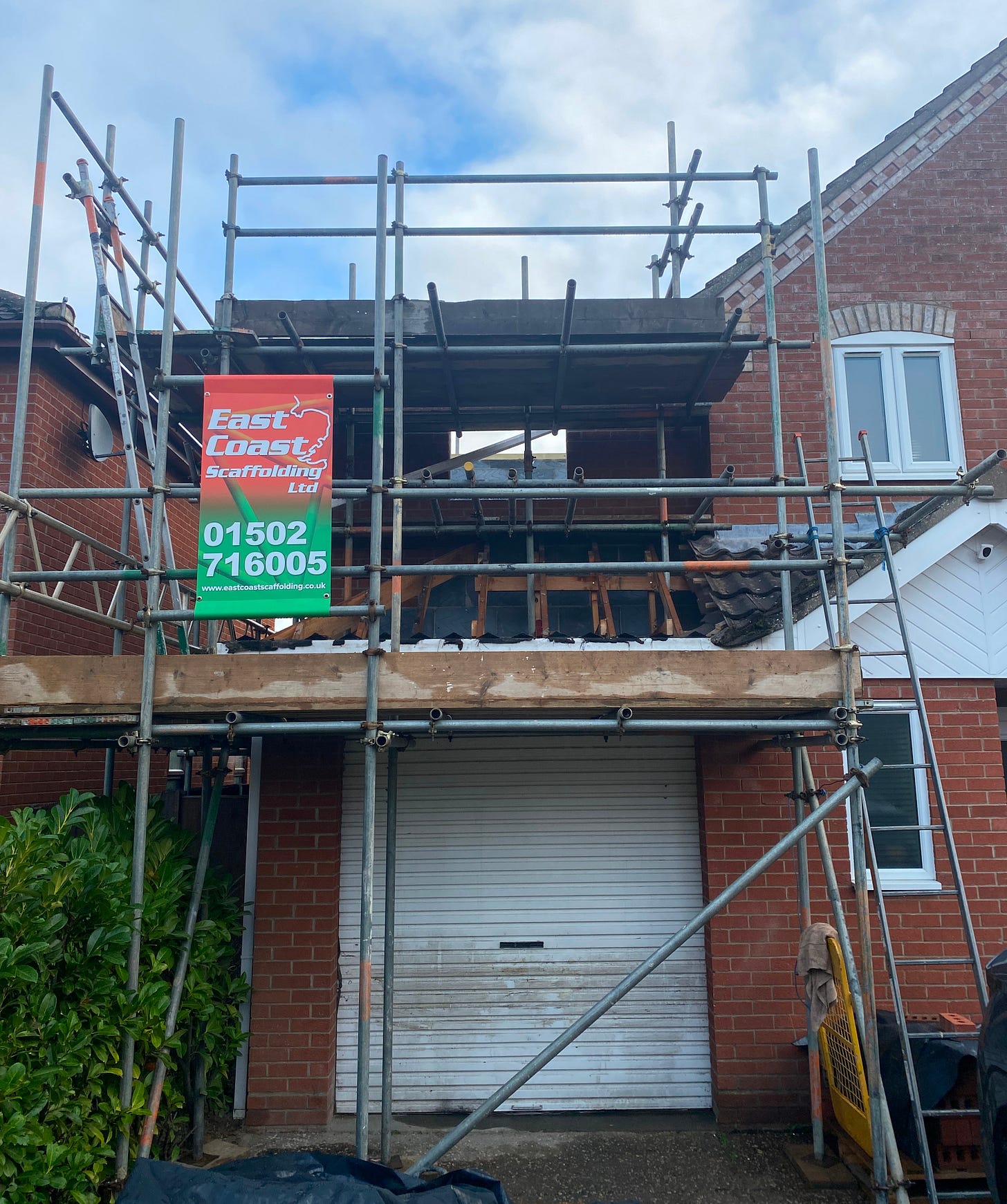 scaffolding constructed up against the side of the house