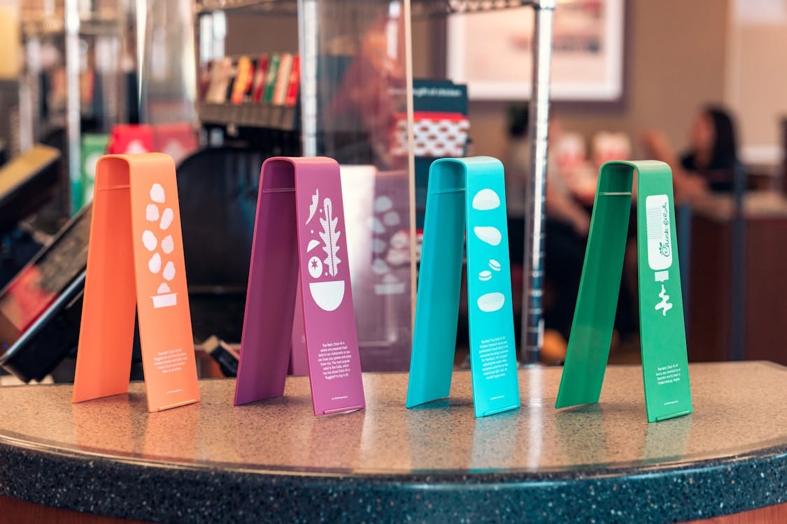 Free Vibrant, informative table displays in a modern fast-food restaurant setting. Stock Photo