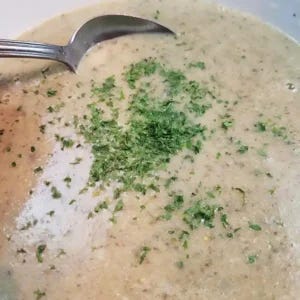 Boil & Blend Creamy Mushroom Soup taking a spoonful