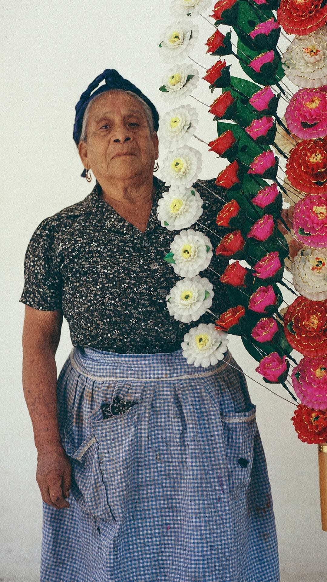 Image may contain Plant Human Person Flower Blossom Flower Arrangement and Flower Bouquet