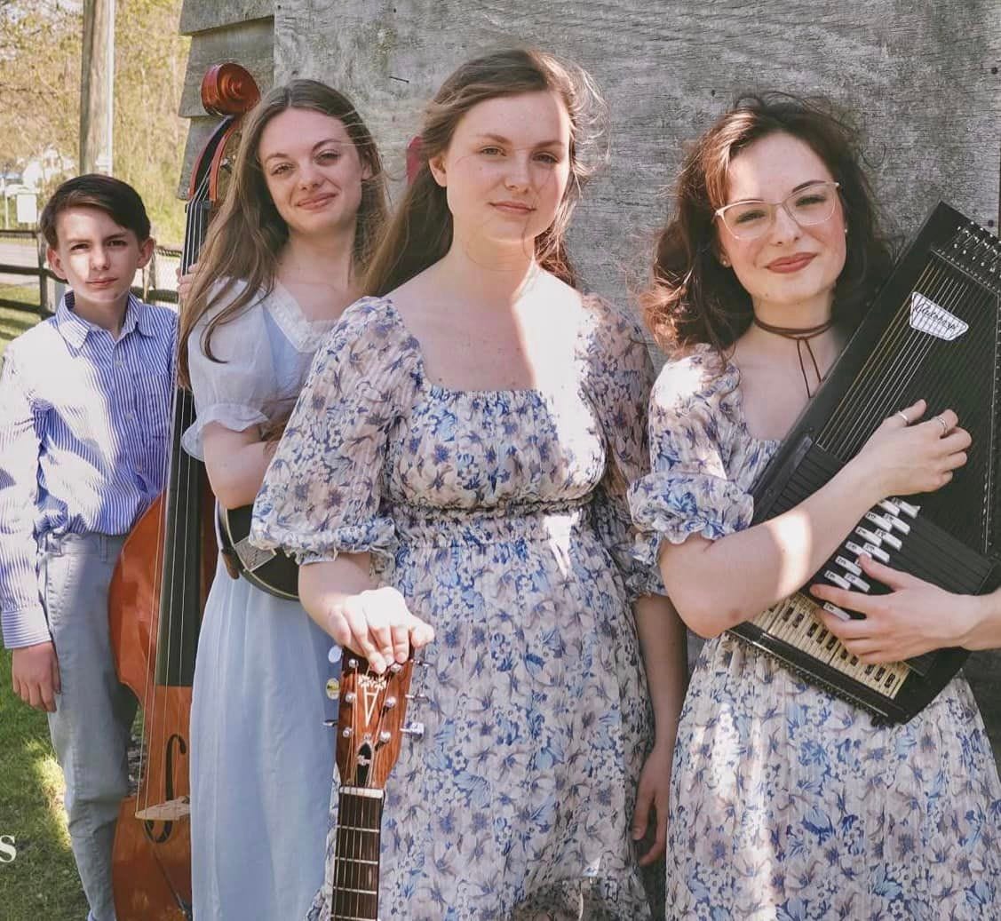 May be an image of 3 people, dirndl, accordion and violin