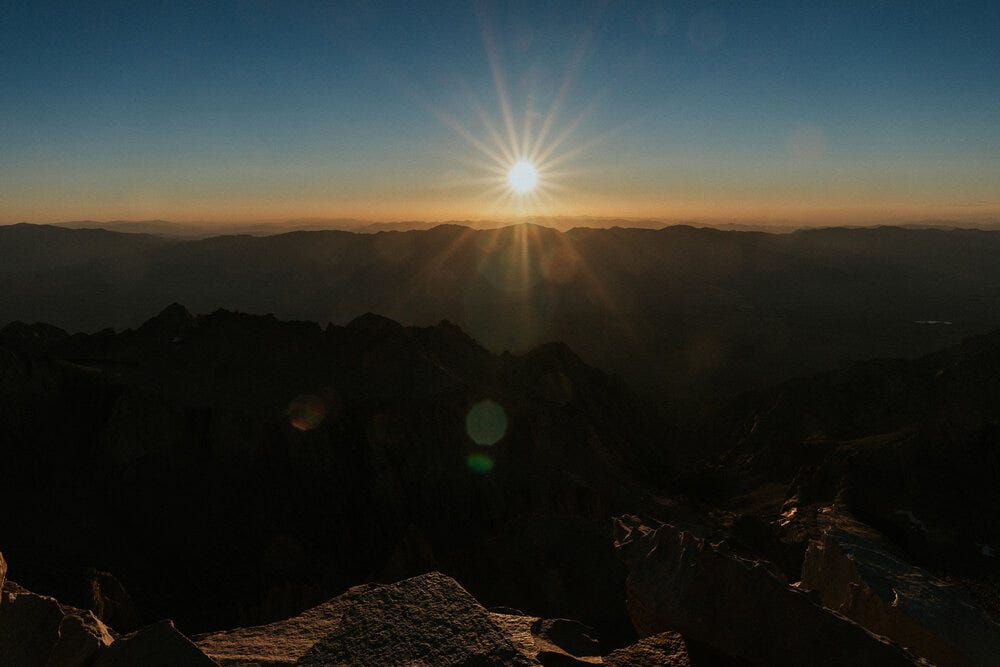 Dust on my lens, sun in the sky. The top of Mount Whitney.