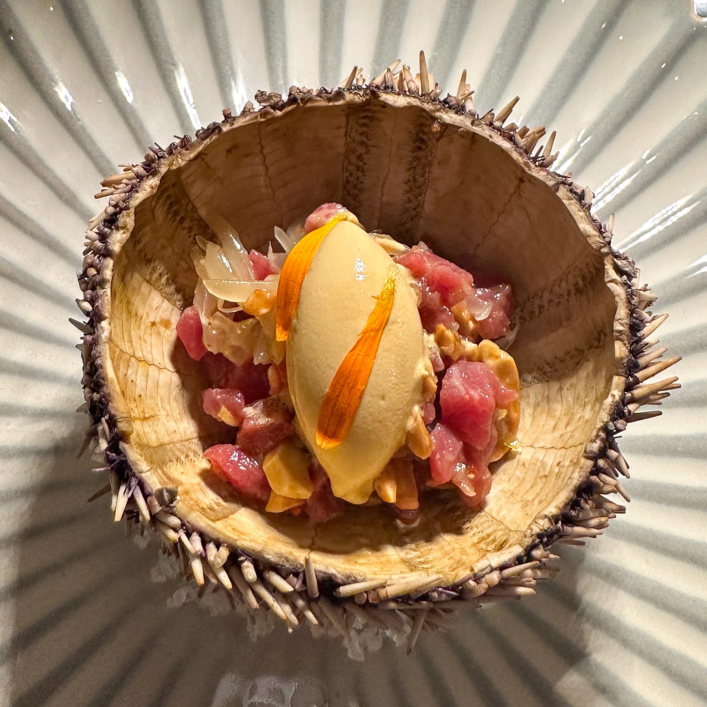 smoked veal tartare with sea urchin ice cream and peanuts at Amalia restaurant in Paris