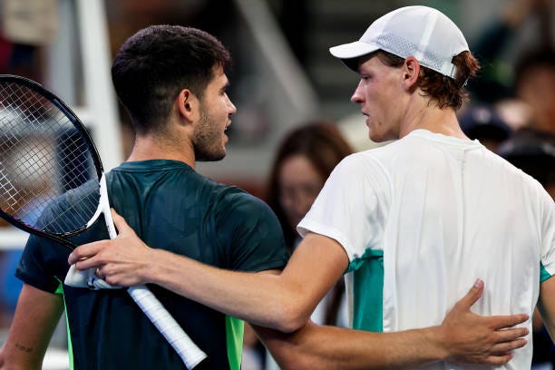 Jannik Sinner of Italy consoles Carlos Alcaraz of Spain after their Men's Singles Semi-final match on day eight of 2023 China Open at the National...