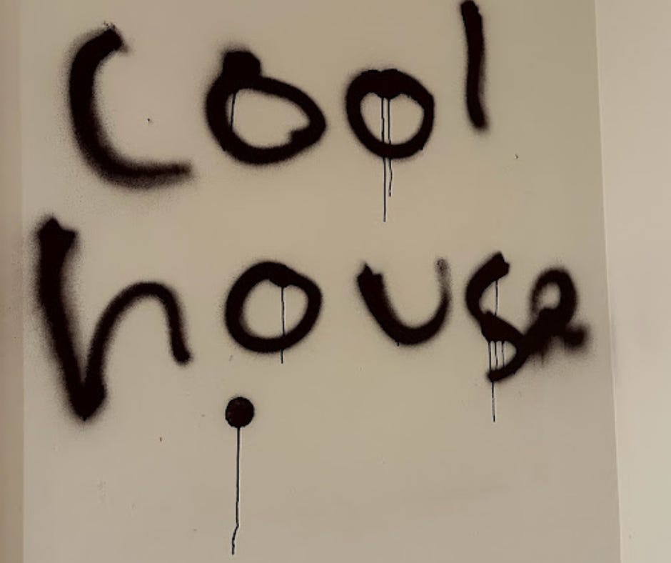 "Cool house" written in black spray paint 