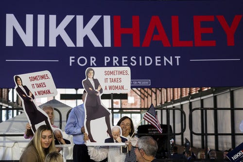 Supporters for Republican presidential candidate Nikki Haley hold their own signs after her speech Wednesday, Feb., 15, 2023, in Charleston, S.C. Haley launched her 2024 presidential campaign on Wednesday, betting that her boundary-breaking career as a woman and person of color who governed in the heart of the South before representing the U.S. on the world stage can overcome entrenched support for her onetime boss, former President Donald Trump.(AP
 Photo/Mic Smith)