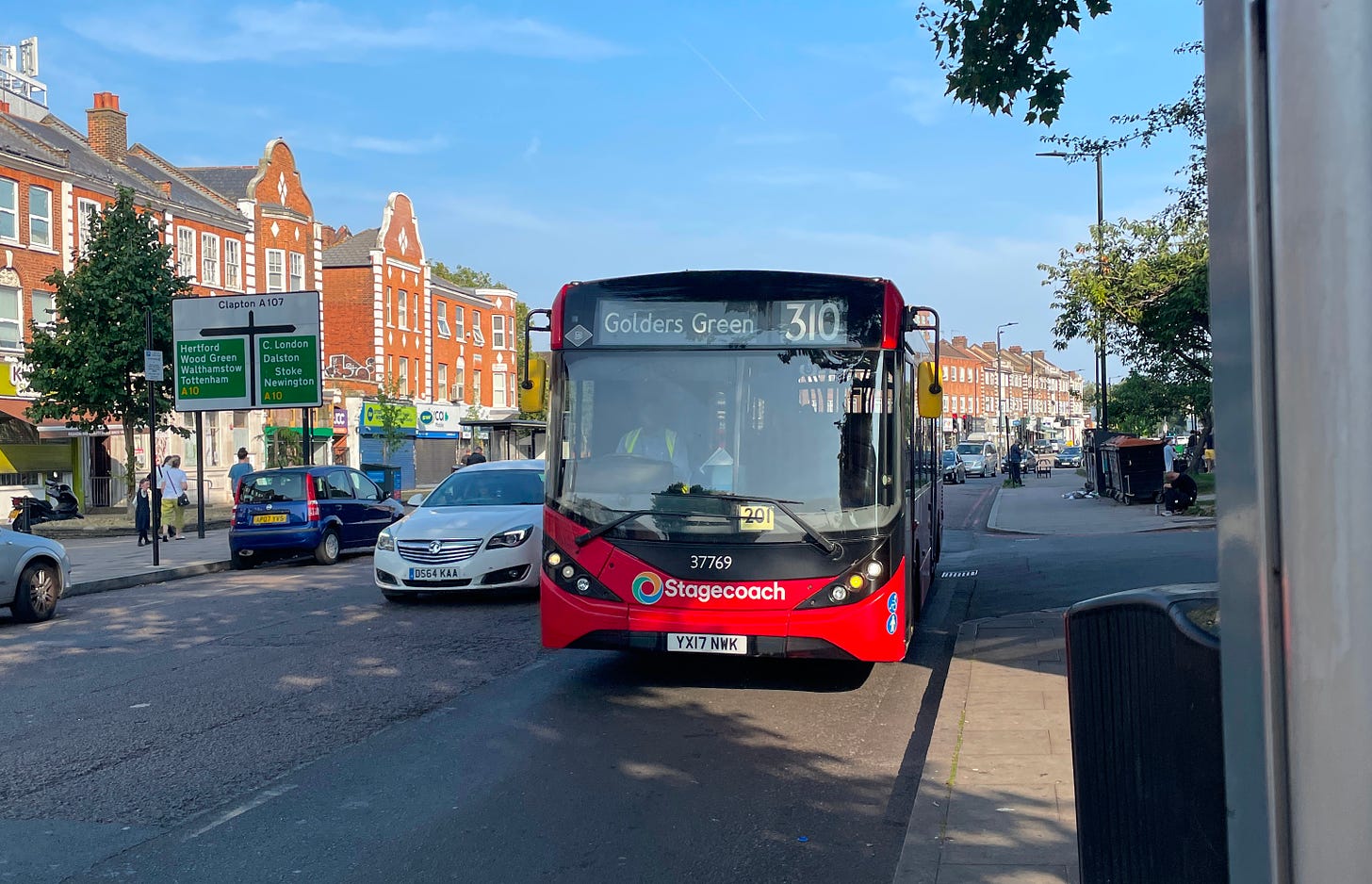 A single-decker bus that says 310 Golders Green on the front