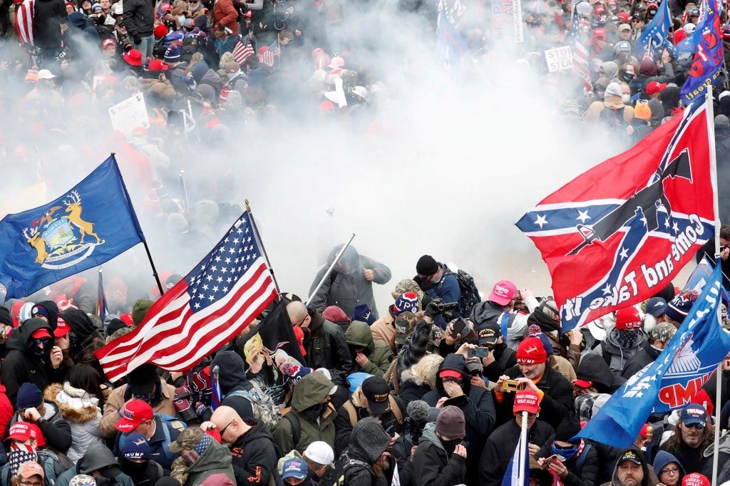 Tear gas is released into a crowd of protesters during clashes with police at the US Capitol rally on Jan. 6, 2021. 