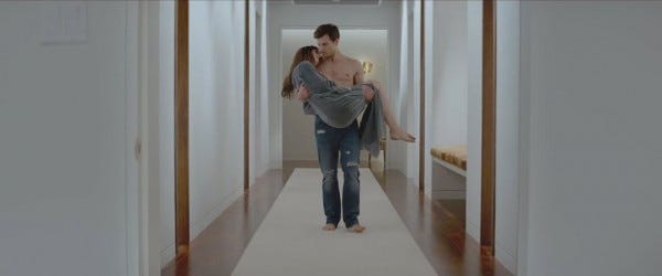 jamie dornan shirtless carrying dakota johnson in fifty shades of grey 2015