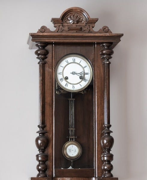 brown pendulum clock