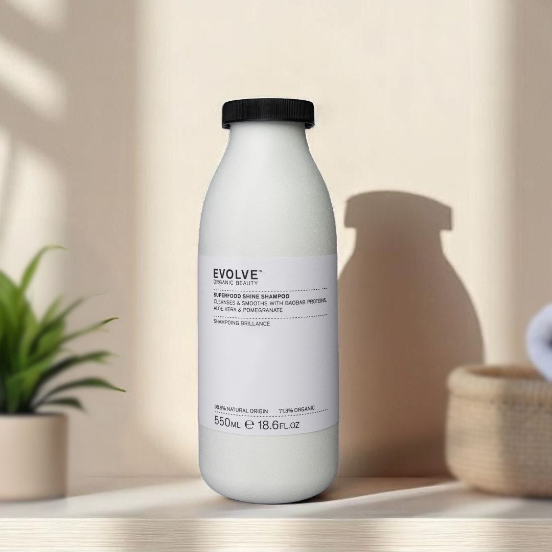 Evolve X Pulpex sustainable fibre refill bottle of Evolve Organic Beauty Superfood Shine Shampoo on a natural wood shelf