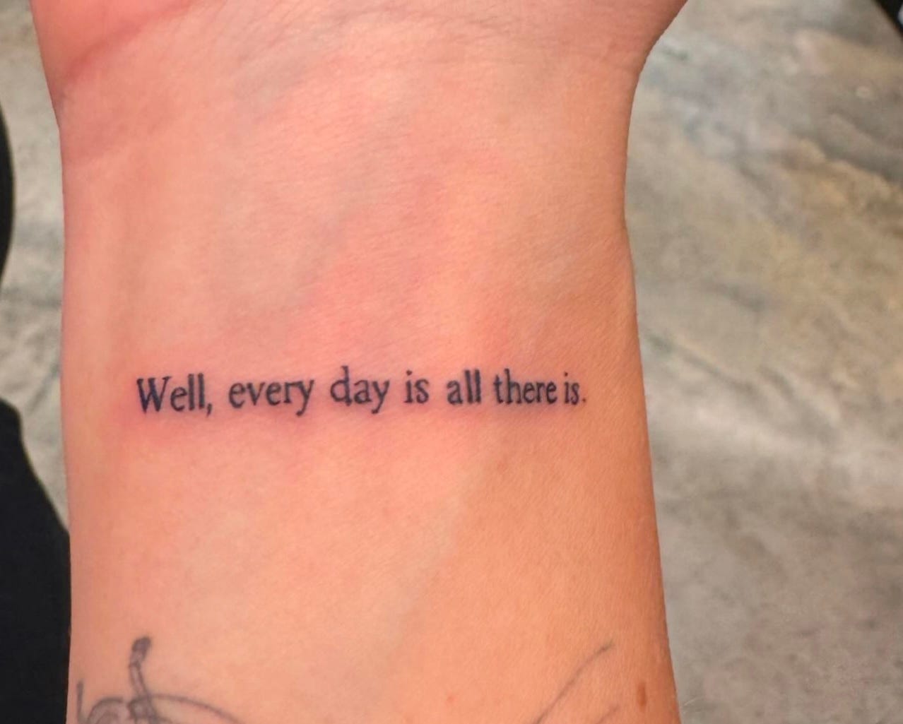 Busy's new tattoo, on her inner wrist, reads "Well, every day is all there is," a quote by Joan Didion