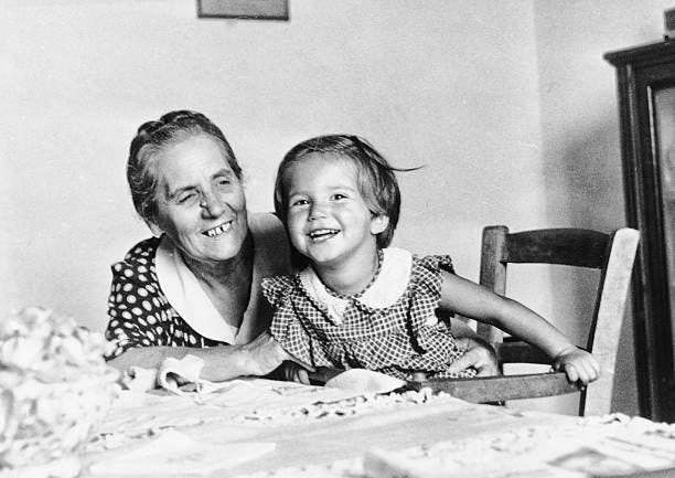 little girl with her grandmother in 1949 - black and white old grandmothers stock pictures, royalty-free photos & images