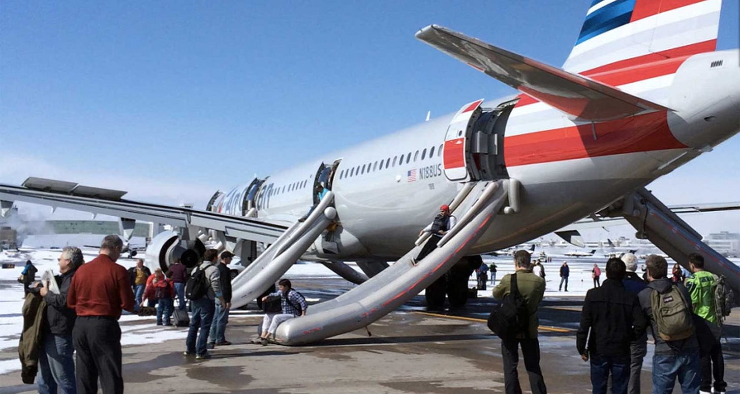 Airplane with emergency evacuation slides deployed.