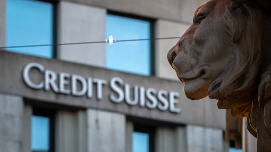 A sign of Credit Suisse bank is seen on a branch building in Geneva, on March 15, 2023.