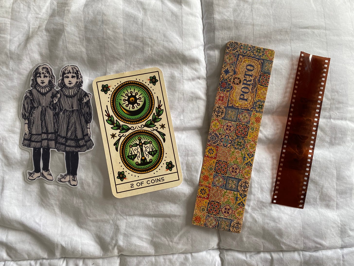 drawn twins illustration bookmark, 2 of coins tarot card traditional style, colorful Porto bookmark, film strip