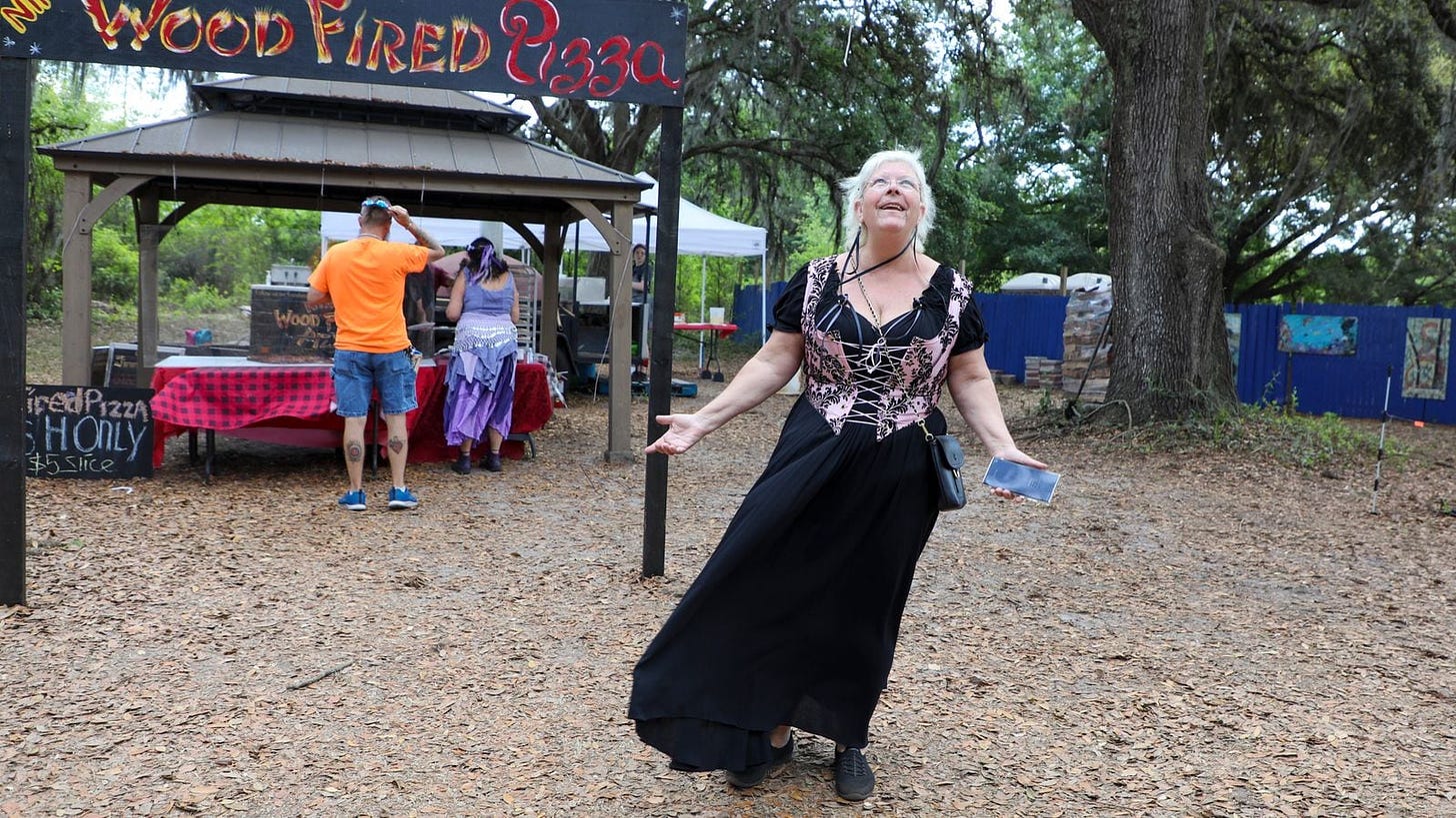 Barbara Walker revels in the aroma of Nina’s Wood Fired Pizza while on a smelling adventure at the Bay Area Renaissance Festival in March in Dade City. After decades without a sense of smell, she has devoted herself to trying to train her ability back.