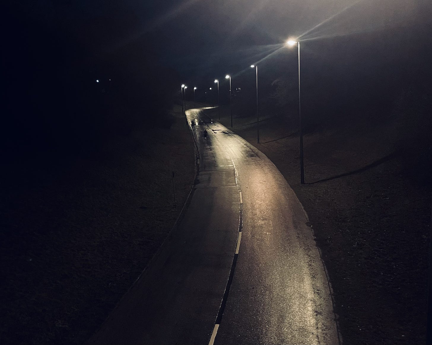 The author running along a road at night