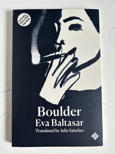 A woman smokes a cigarette on the cover of Boulder