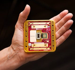 Photo showing a close up of the Majorana 1 quantum chip being held in a hand.