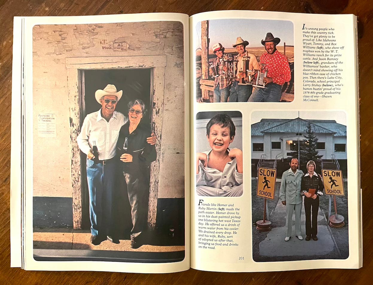 National Geographic magazine lies open on a wooden table: On the left page is a photograph of a man in a white cowboy hat, white shirt and blue jeans, with his arm around a woman wearing black. Standing in front of a building where the paint is chipped and peeling, both hold bottles of Coca Cola and are laughing. On the right page are three photographs: a group of cowboys holding trophies, a little boy pulling a silly face, and two men in seventies leisure suits standing on the sidewalk in front of a school.