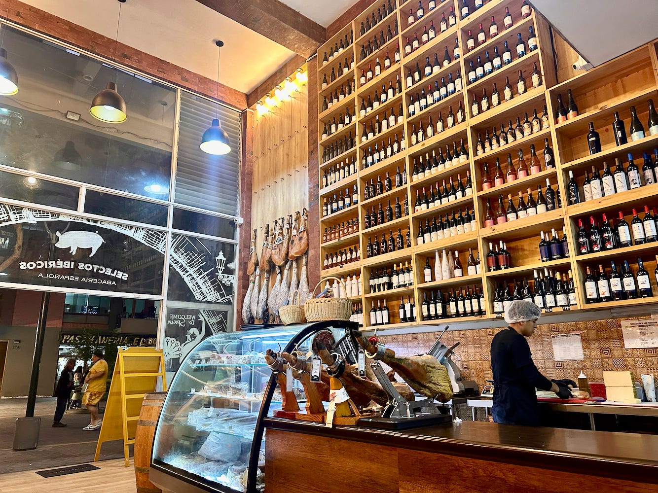 Inside of Selectos Ibericos with walls of Spanish wine and Jamon in Miraflores, Lima
