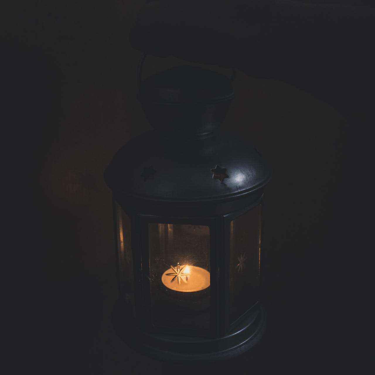 photo of a candle in a lantern