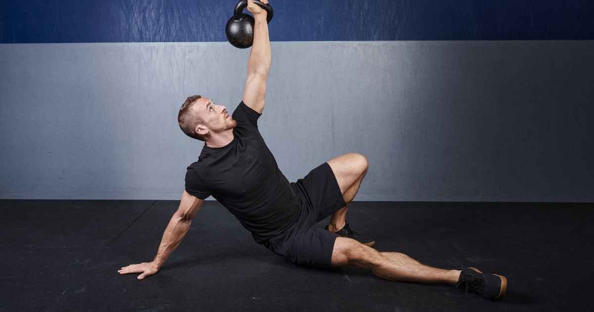 man performing a kettlebell Turkish get-up
