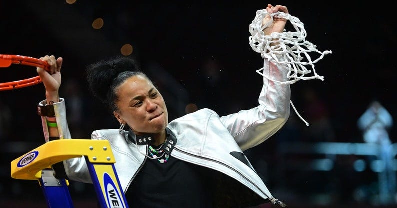 South Carolina womens basketball coach Dawn Staley cutting the nets after defeating the Iowa Hawkeyes in the National Championship. Mandatory Credit: Ken Blaze-USA TODAY Sports
