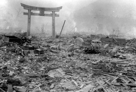 This August 10, 1945 picture shows burnt ruins with only the structure of a torii (gate) for a shrine standing, in Nagasaki.