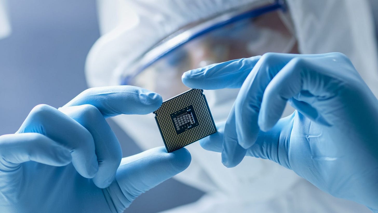 Engineer holds microchip