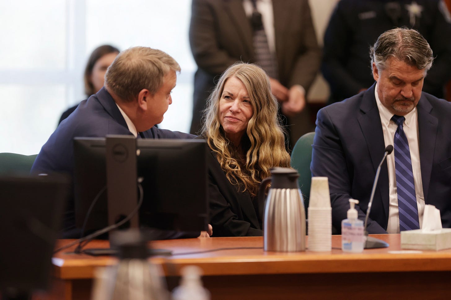 <p>Lori Vallow Daybell smiles as she talks with her lawyers before the jury’s verdict is read</p>