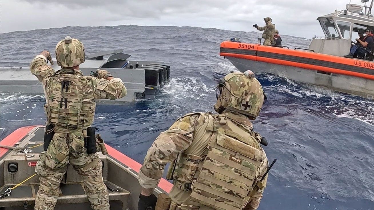 US Coast Guard crews prepare to board a drug smuggling vessel. US Coast Guard crews prepare to board a drug smuggling vessel.