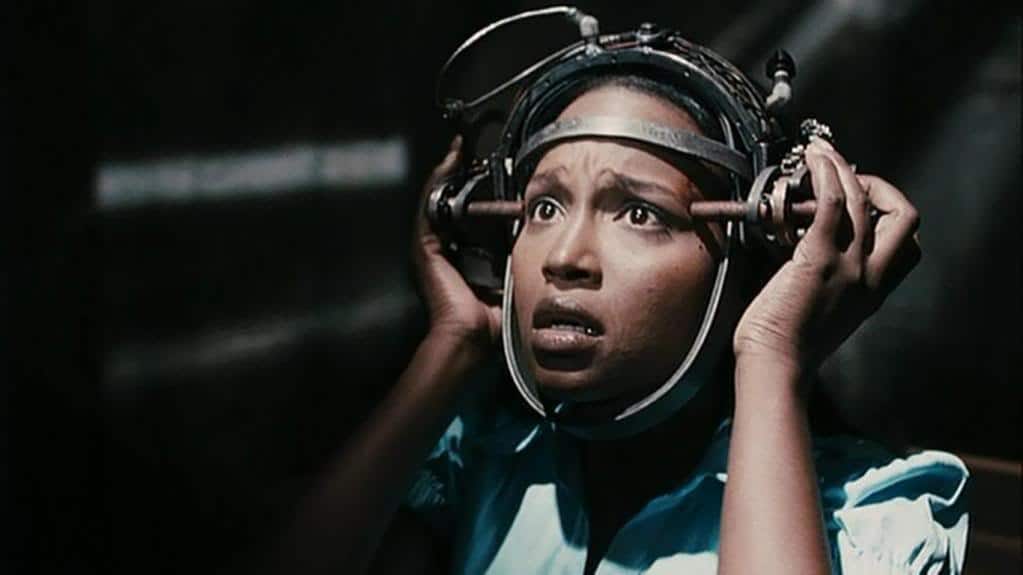 Still from Saw IV. Simone looks panicked as she tries to break free from a contraption stuck to her head.