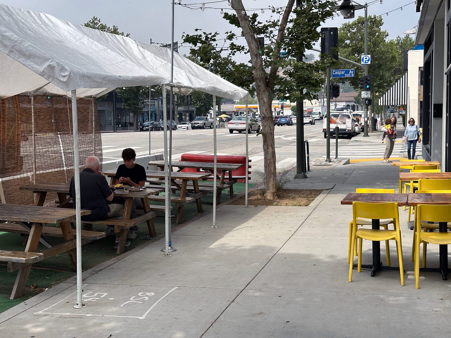 Picnic tables outside of a restaurant