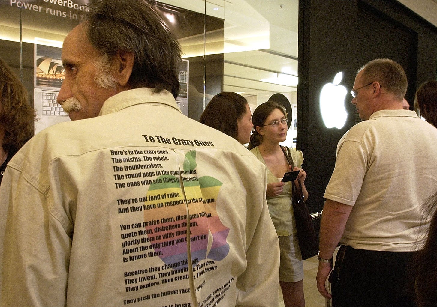 A customer is sporting a homemade "To The Crazy Ones" t-shirt outside Apple International Plaza during Night of the Panther.