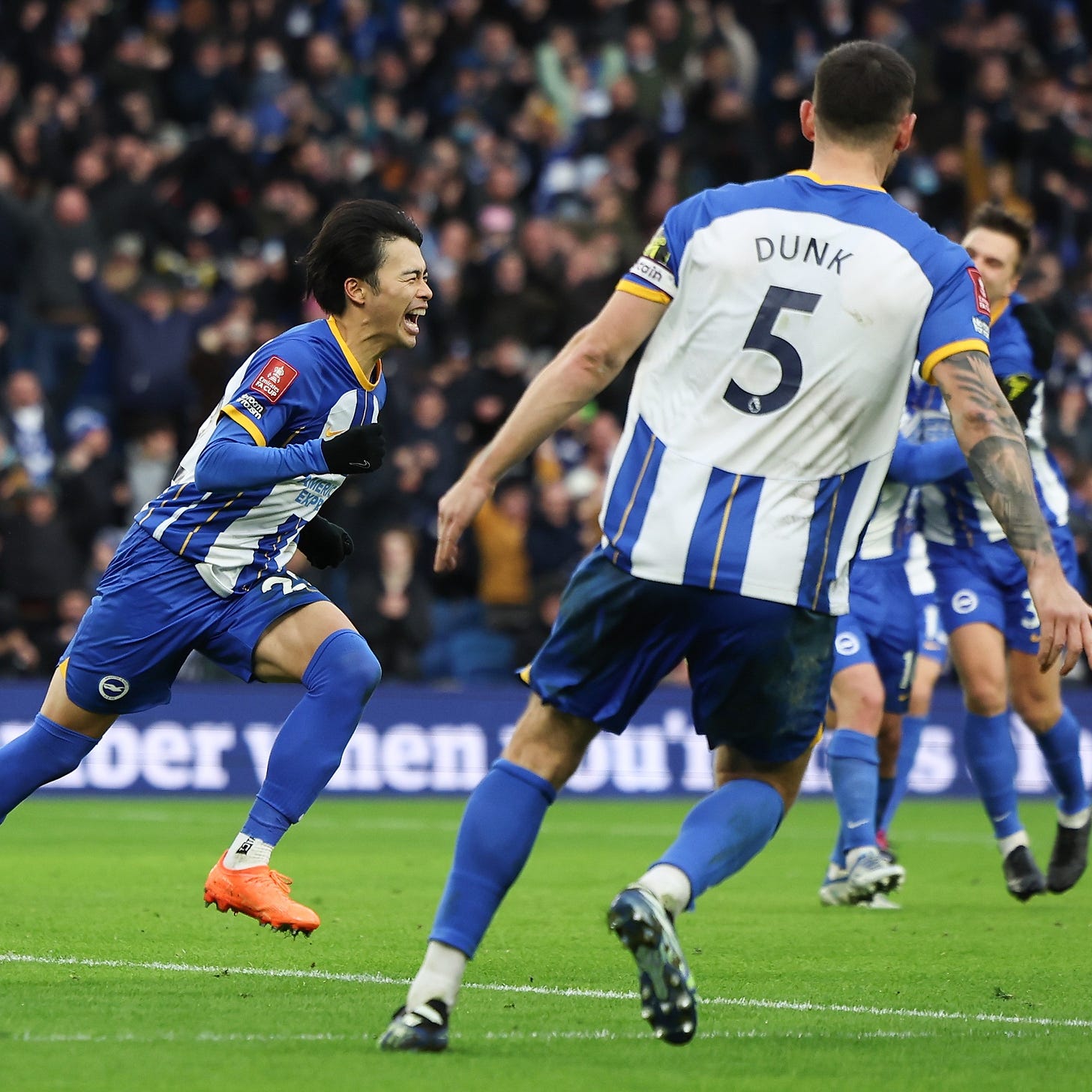 Kaoru celebrates his winner against Liverpool with Dunky in the foreground and Alexis and Joel hugging each other in the background. What. A. Moment.